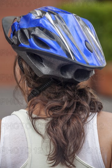 Woman wearing a helmet while cycling, Photo with motion blur, City of Quito, Pichincha province, Ecuador, South America