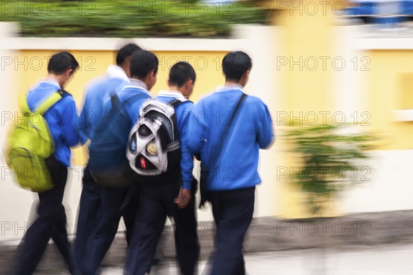 Students going to school, Photo with motion blur, City of Quito, Pichincha province, Ecuador, South America