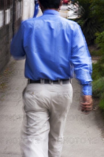 Man walking in street, Photo with motion blur, City of Quito, Pichincha province, Ecuador, South America
