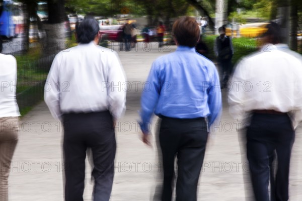 Men walking in street, Photo with motion blur, City of Quito, Pichincha province, Ecuador, South America