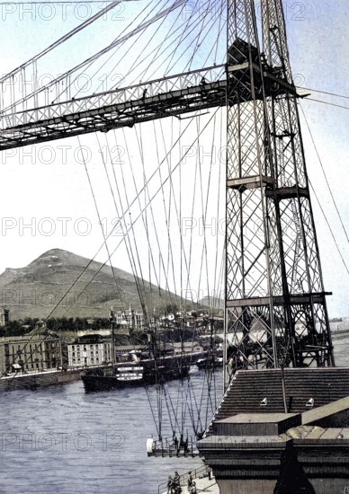 The Vizcaya Bridge, Puente de Portugalete, known in Spain mainly as the Puente Colgante, or suspension bridge. It is not a suspension bridge in the technical sense, but a suspension ferry, an elevated bridge with an attached suspension barge. The ferry was inaugurated in 1893, historical image or illustration, published in 1890, reproduction, digitally enhanced, historical