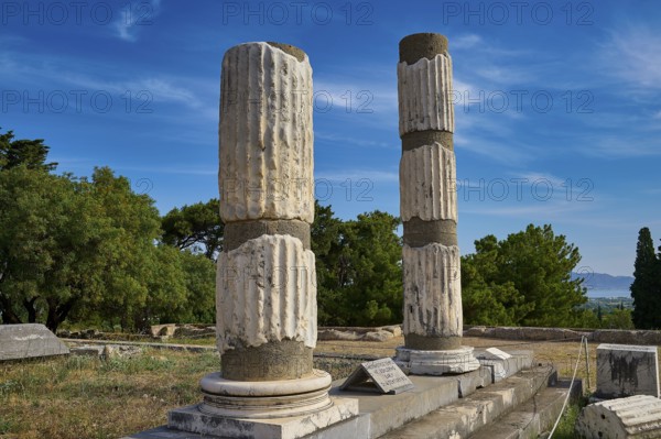 Two Doric columns in the middle of an ancient ruined landscape, Ionian Asclepion temple, Asclepion, Asclepieion, healing temple, temple, Hippocrates, Kos, Dodecanese, Greek Islands, Greece