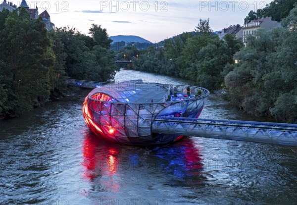 Murinsel floating island on the river Mur by night, Graz, Austria