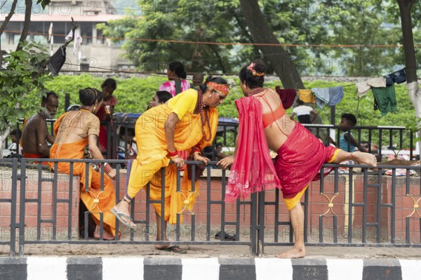 Devotees try to cross a divider as they arrives to visit Kamakhya Temple during Ambubachi Mela, in Guwahati, India on June 22, 2025. The Ambubachi Mela is one of the most spiritually significant and culturally unique festivals in India