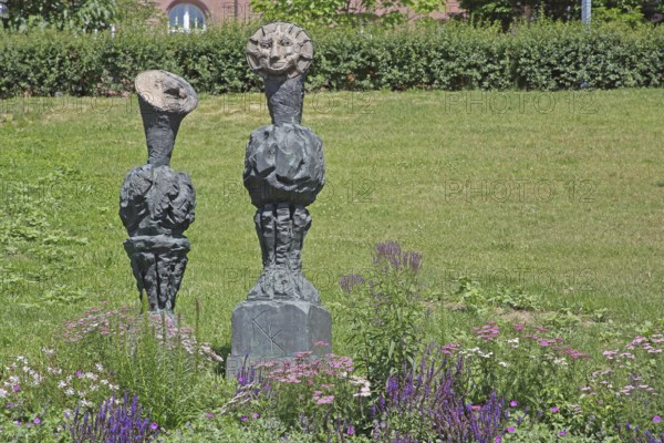 Sculpture Sun and Moon by Markus Lüpertz 2017, modern art, bronze sculpture, two faces, moon face, symbol, figures, astronomy, Blumenhof, Pforzheim, Northern Black Forest, Black Forest, Baden-Württemberg, Germany