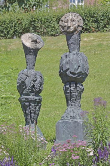 Sculpture Sun and Moon by Markus Lüpertz 2017, modern art, bronze sculpture, two faces, moon face, symbol, figures, astronomy, Blumenhof, Pforzheim, Northern Black Forest, Black Forest, Baden-Württemberg, Germany
