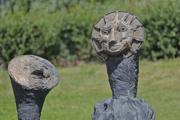 Sculpture Sun and Moon by Markus Lüpertz 2017, modern art, bronze sculpture, two faces, moon face, symbol, figures, astronomy, detail, Blumenhof, Pforzheim, Northern Black Forest, Black Forest, Baden-Württemberg, Germany