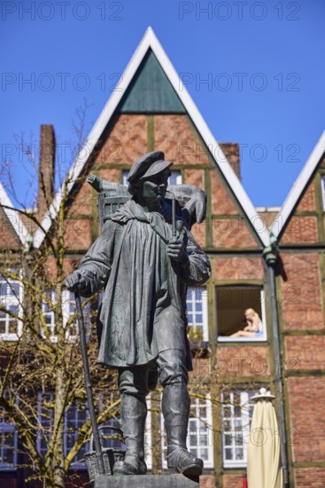 Kiepenkerl monument, bronze sculpture, brick architecture, depth of field, blue cloudless sky, Spiekerhof, Münster, Münsterland, independent city, North Rhine-Westphalia, Germany