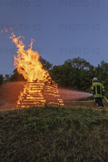 Firefighter in action at the midsummer fire in the Lenninger Valley