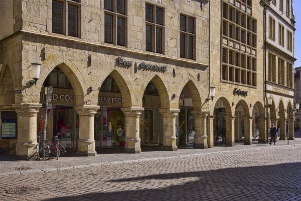 Old town, historic buildings, arcades, facade, window, lamp, wall anchor, cobblestone street, shadow, sidelight, Prinzipalmarkt, Münster, Münsterland, independent city, North Rhine-Westphalia, Germany