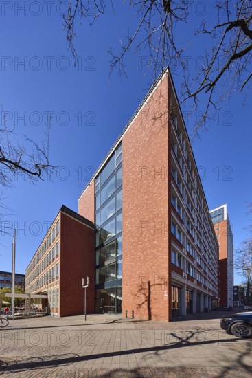 Stadthaus 1, city centre, brick building, bare wintry trees, blue cloudless sky, Heinrich-Brüning-Straße, Münster, Münsterland, independent city, North Rhine-Westphalia, Germany