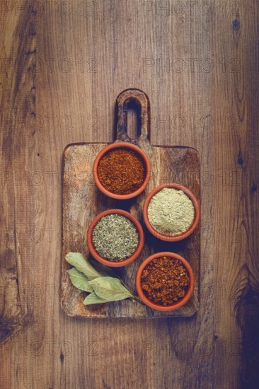 Georgian spices, in ceramic bowls, assortment, set of spices, utsho, adjika, Svan salt, ground coriander, top view, no people