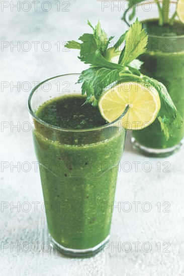 Glass with green smoothie, celery and spinach, apple and kiwi, cucumber, vegetable smoothie, breakfast, homemade, no people