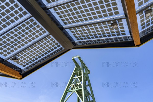 Electric charging station on the site of the former Lohberg colliery in Dinslaken, operated by Fastned, uses electricity from wind power and solar energy, fast-charging columns, with its own solar roof, Lohberg colliery headframe, North Rhine-Westphalia, Germany