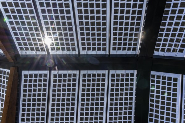 Transparent solar roof of the electric charging station on the site of the former Lohberg colliery in Dinslaken, operated by Fastned, uses electricity from wind and solar power, fast-charging stations, North Rhine-Westphalia, Germany