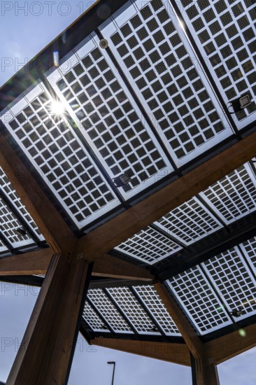 Transparent solar roof of the electric charging station on the site of the former Lohberg colliery in Dinslaken, operated by Fastned, uses electricity from wind and solar power, fast-charging stations, North Rhine-Westphalia, Germany
