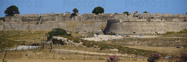 Mighty stone wall of a fortress under a blue sky with a wide entrance, Antimacheia, Medieval Fortress, St John's Fortress, Antimachia, Kos, Dodecanese, Greek Islands, Greece