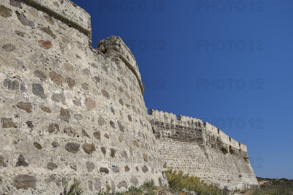 Close-up of massive stone wall building with clear blue sky, Antimacheia, Medieval Fortress, St John's Fortress, Antimachia, Kos, Dodecanese, Greek Islands, Greece