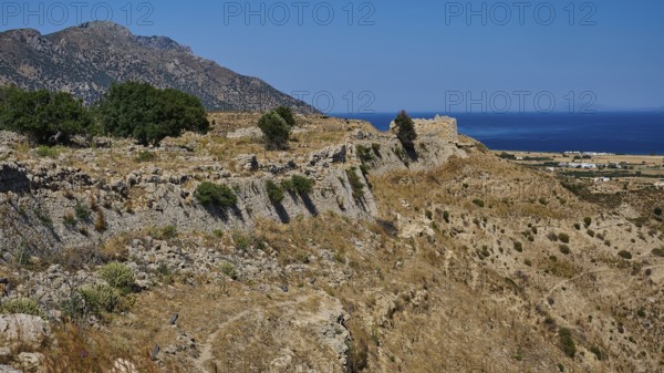Rocky ruins on a coastal landscape with sea and sunny sky, Kardamina, Antimacheia, Medieval fortress, St John's fortress, Antimachia, Kos, Dodecanese, Greek Islands, Greece