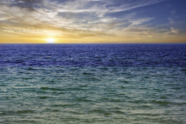 Turquoise blue sea, calm water surface, sunset, offshore island of Heligoland, Schleswig-Holstein, Germany