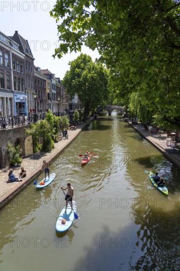 The old town centre of Utrecht, Oudegracht, around 2 km long with many old houses, shops, restaurants directly on the canal, many bridges, boat traffic of all kinds, Netherlands