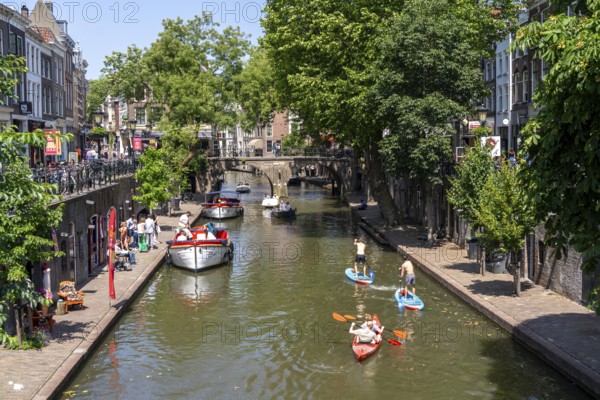 The old town centre of Utrecht, Oudegracht, around 2 km long with many old houses, shops, restaurants directly on the canal, many bridges, boat traffic of all kinds, Netherlands