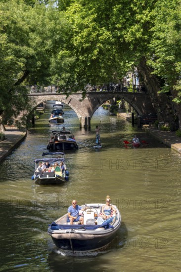 The old town centre of Utrecht, Oudegracht, around 2 km long with many old houses, shops, restaurants directly on the canal, many bridges, boat traffic of all kinds, canal cruise, Netherlands