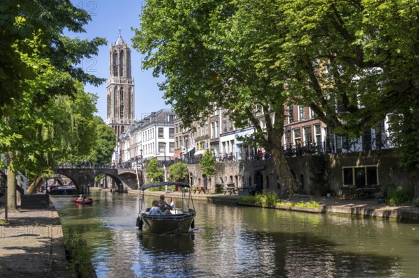 The old town centre of Utrecht, Oudegracht, around 2 km long with many old houses, cathedral tower, highest church tower in the Netherlands, newly renovated, shops, restaurants directly on the canal, many bridges, boat traffic of all kinds, canal tour, Netherlands