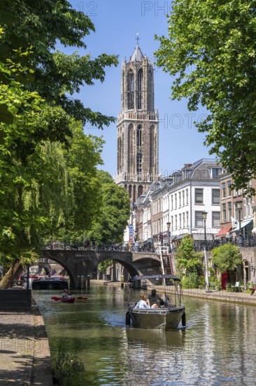 The old town centre of Utrecht, Oudegracht, around 2 km long with many old houses, cathedral tower, highest church tower in the Netherlands, newly renovated, shops, restaurants directly on the canal, many bridges, boat traffic of all kinds, canal tour, Netherlands