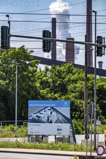 Construction site sign for thyssenkrupp Steel's first direct reduction plant, the climate-neutral steel production project, at the existing steelworks in Duisburg-Farn, pig iron production without a conventional blast furnace but using hydrogen, due to go into operation by the end of 2027, North Rhine-Westphalia, Germany
