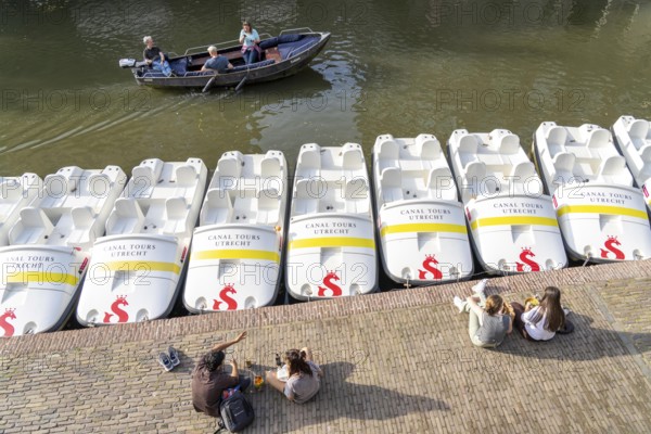 The old town centre of Utrecht, Oudegracht, around 2 km long with many old houses, pedal boat hire, many bridges, boat traffic of all kinds, canal cruise, Netherlands