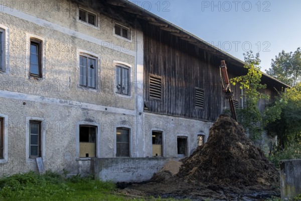 Large farm building with dung heap in the foreground, rural, Bavaria, Germany