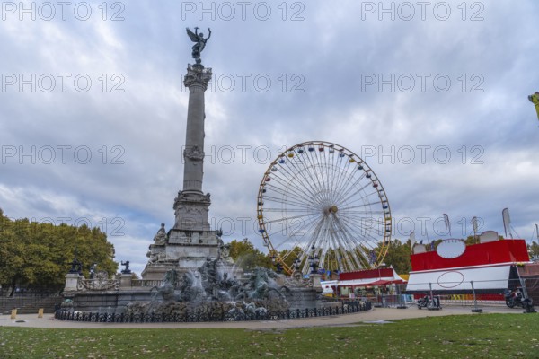 Bordeaux city, ferris wheel near monument aux girondins, a memorial to the girondists, a political group of the french revolution