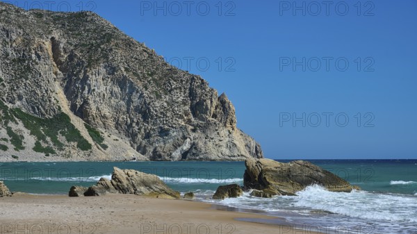Beach, Kavo Paradiso, Paradise Beach, beach with rocky coast and clear blue sky by the sea, Kefalos, Kos, Dodecanese, Greek Islands, Greece