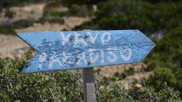 Beach, Kavo Paradiso, Paradise Beach, Blue wooden sign with the inscription 'KAYO PARADISO' in natural surroundings, Kefalos, Kos, Dodecanese, Greek Islands, Greece
