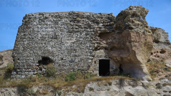 Ruins of a castle, Dilapidated stone ruins with exposed walls, surrounded by natural landscape under blue sky, Kefalos, Kos, Dodecanese, Greek Islands, Greece