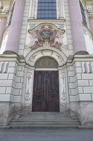 Side entrance portal of the east tower of the baroque Basilica of St Alexander and Theodor, Ottobeuren, Unterallgäu, Bavaria, Germany