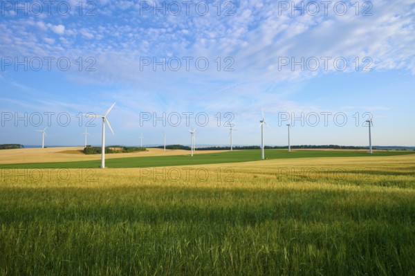 Wind turbines in a wide, green landscape with blue sky, summer, Höhefeld, Wertheim, Baden-Württemberg, Germany