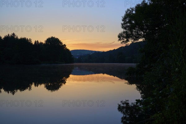 Twilight steals over a quiet river Main, whose water reflects the soft colours of the sky, summer, Grünenwört, Wertheim, Main, Main-Tauber-Kreis, Baden-Württemberg, Germany