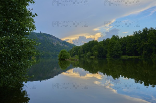 The calm river Main reflects trees and an impressive sky streaked with evening clouds, summer, Grünenwört, Wertheim, Main, Main-Tauber-Kreis, Baden-Württemberg, Germany