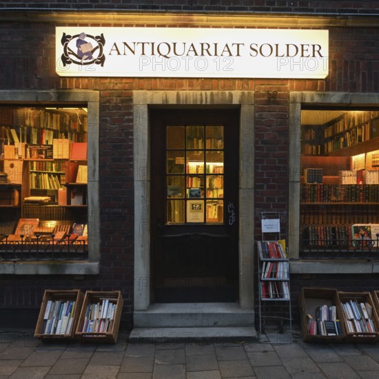 Antiquarian bookshop, Solder bookshop, Wilsberg, famous film location of the Wilsberg crime thriller in the city of Münster, atmospheric evening light, Westphalia, North Rhine-Westphalia, Germany, Western Europe