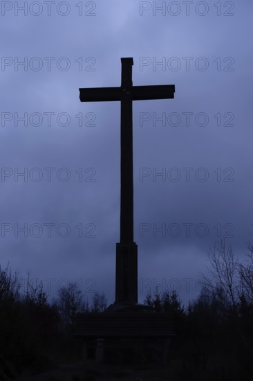 The cross... Schiebergkreuz, Balve, gloomy mood, dark clouds, upcoming thunderstorm, backlight shot, summit cross in the darkness, atmospheric threatening weather conditions, Schiebergkreuz in Balve, Märkischer Kreis, Sauerland, Germany, Western Europe