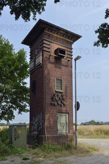 Old transformer station... Mönchengladbach Hilderath (North Rhine-Westphalia) was converted into a nature conservation station, provides nesting aids, harbours barn owls, kestrels, swifts, swallows, various songbirds, bats as well as insects and butterflies, Lower Rhine, Mönchengladbach, North Rhine-Westphalia, Germany, Western Europe