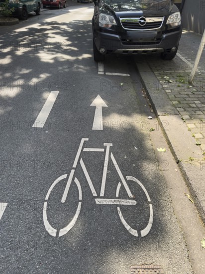 A cycle path on which a car park is marked for cars, Wuppertal, Germany