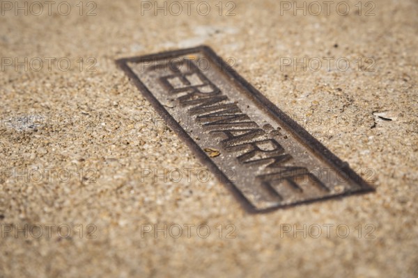 Sign for district heating on a manhole cover in Wuppertal, Germany