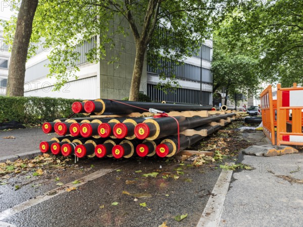 A stack of district heating pipes at a construction site in Wuppertal, Germany