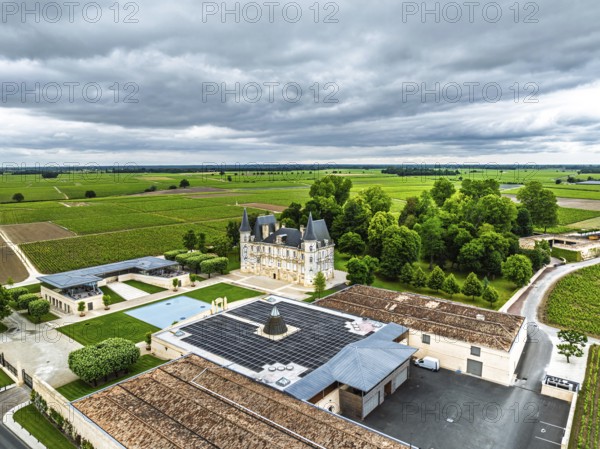 Chateau Pichon Longueville Baron Vineyard and grape fields around Pauillac from a drone, Bordeaux, Gironde, Nouvelle-Aquitaine, France