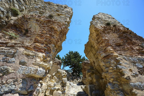 Two massive ancient stone arches open to a clear blue sky, Abandoned Village, Lost Place, Pyli, Paleo Pyli, Byzantine Fortress, Kos, Dodecanese, Greek Islands, Greece
