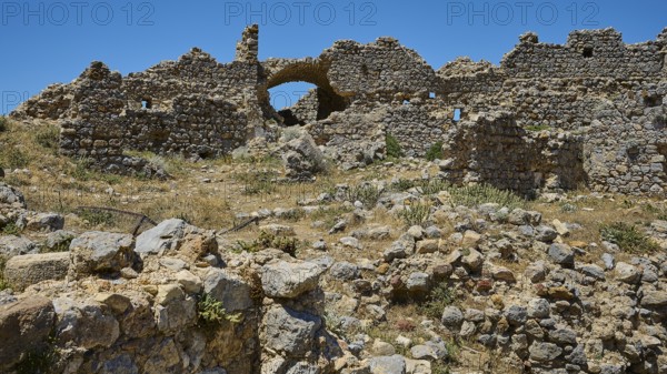 A vast field of ruins with brick arches under a bright blue sky, Abandoned Village, Lost Place, Pyli, Paleo Pyli, Byzantine Fortress, Kos, Dodecanese, Greek Islands, Greece