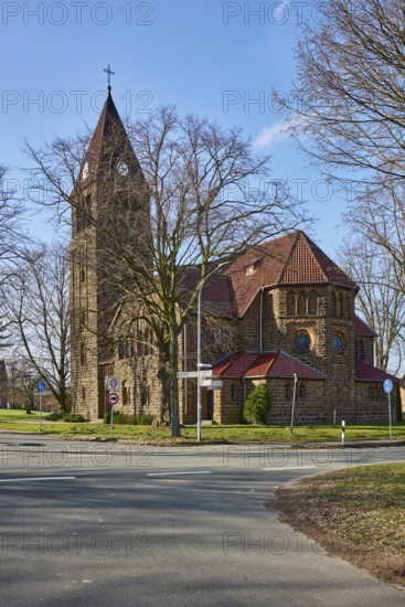 Church Oberlübbe, Evangelical-Lutheran parish Oberlübbe-Rothenuffeln, bare winter trees, blue sky with cumulus clouds, intersection Ellernstraße with Korfskamp, Hille, Mühlenkreis Minden-Lübbecke, North Rhine-Westphalia, Germany